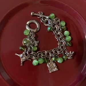 Vintage Charming Silver and Green Charm Bracelet it says “her Royal Highness”